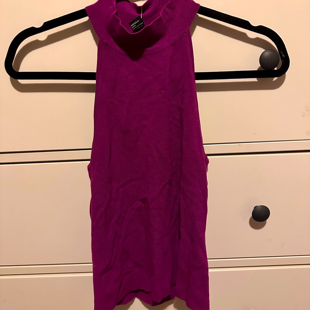 Purple sleeveless top. Criss Cross back. Size SMALL.